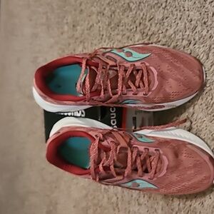 Saucony size 10.5, rust colored, green accent athletic shoes.